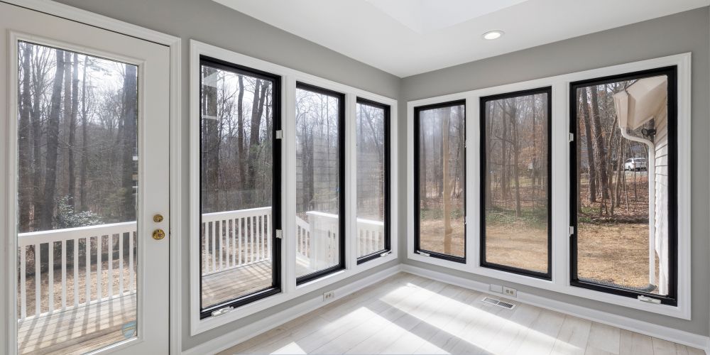 Interior view showcasing large replacement windows and doors in Chandler, AZ, bringing natural light into a modern living space.