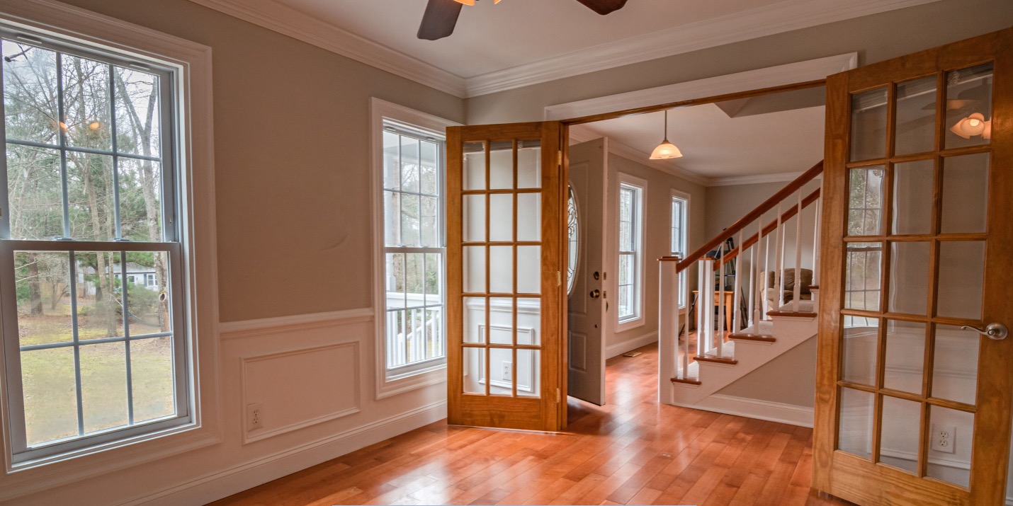Bright residential interior featuring replacement windows in Mesa AZ that enhance natural light, comfort, and energy efficiency.